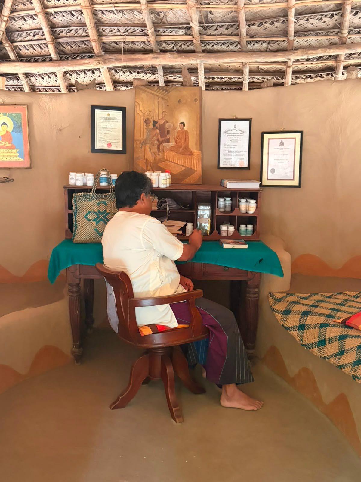 Dr Srilal at his desk in the Ayurveda Centre